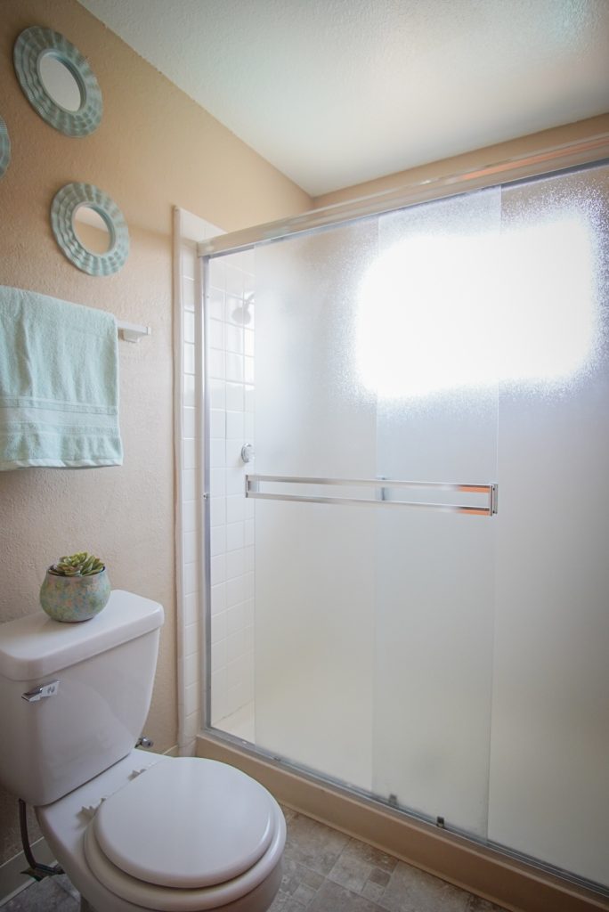 Shower and Toilet in bathroom for 1 bed 1 bath, 686 square foot apartment